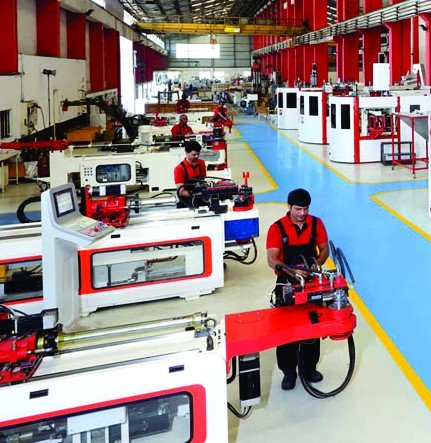CNC tube bender in operation on the production floor